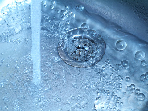 water running in kitchen sink from tap