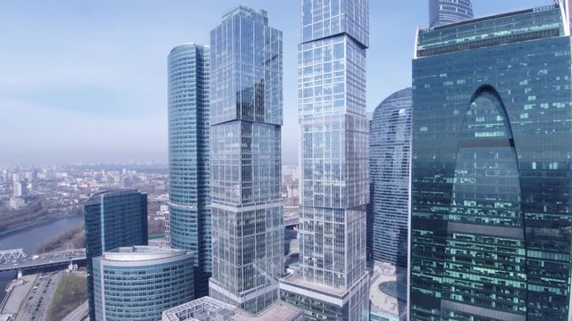 Through glass towers. Aerial shot of skyscrapers of Moscow International Business Centre, Moscow-city, 4K