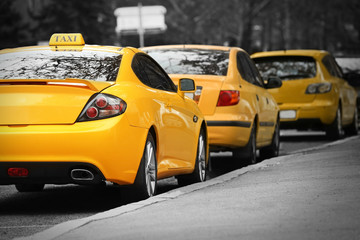 Closeup of yellow taxi cab in traffic jam