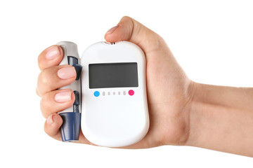 Woman's hand holding digital glucometer and lancet pen on white background. Diabetes concept