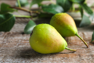 Delicious ripe pears on table