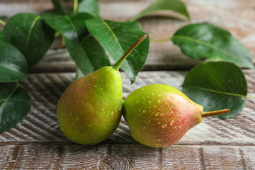 Delicious ripe pears on table