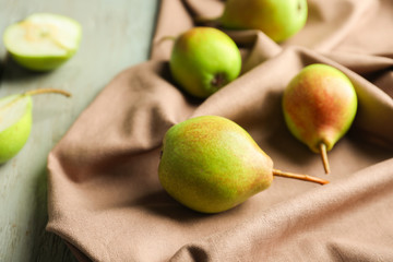 Delicious ripe pears on napkin