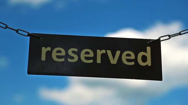 Access to paradise reserved. Plate with word Reserved on sky background