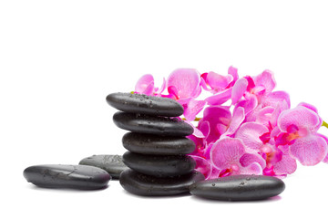 Fototapeta na wymiar Spa stones and orchid flowers, isolated on white.