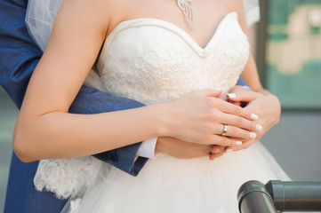 Wedding details of the bride and groom, hugs