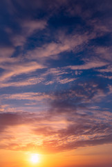 Naklejka na ściany i meble Romantic beautiful sunset in the sky and clouds.