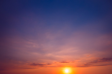 An unusual sunset against a blue-violet sky.