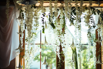 white flowers hanging on the ceiling