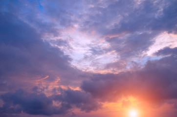 Naklejka na ściany i meble Storm clouds at dawn and bright sun.