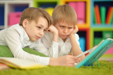 Obraz premium two bored boys doing homework