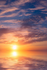 Fototapeta na wymiar Romantic beautiful sunset in the sky and clouds over the sea.
