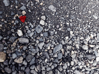 red heart in the middle of the rocks