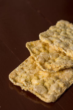 Corn bread slices on the brown wooden table background