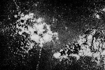 White powder isolated on black background, top view