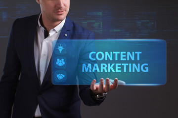 Business, Technology, Internet and network concept. Young businessman working on a virtual screen of the future and sees the inscription: Content marketing