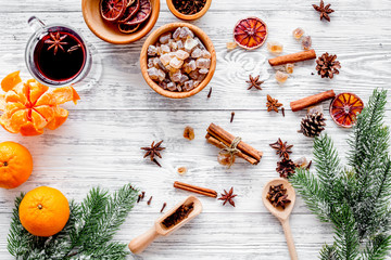 Merry christmas in winter evening with warm drink. Hot mulled wine or grog with fruits and spices...