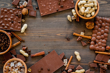 Mockup with chocolate on dark wooden background top view