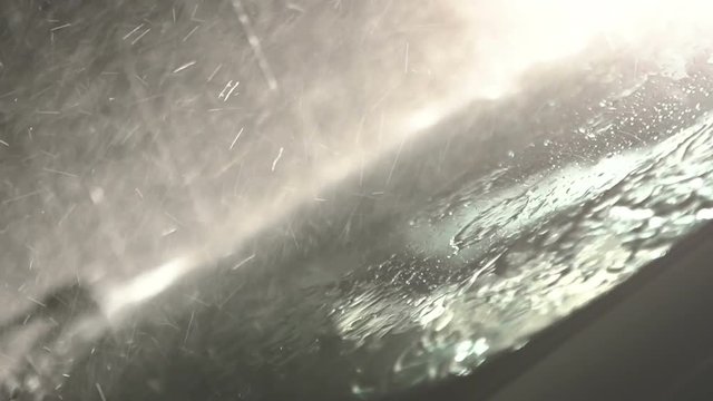 Windshield wiper with rain, during storm. Slow motion. Close up.