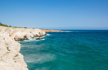 Sea caves of Cavo greco cape. Mediterranean sea landscape