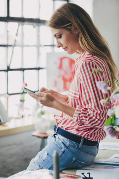 Businesswoman Texting on Her Cell Phone