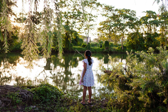 A teenage girl enjoying fishing activity