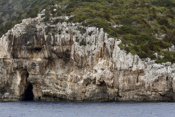 Landscape of an island with a cave in the Ionian Sea, Greece.