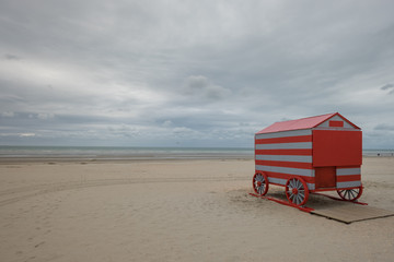 Colorful beach cabin on a cloudy day in De Panne, Belgium.
