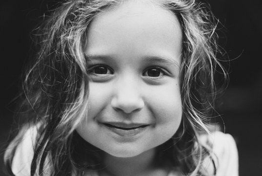 Close up portrait of a beautiful young girl in black and white
