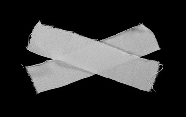 White adhesive bandage isolated on black background, top view