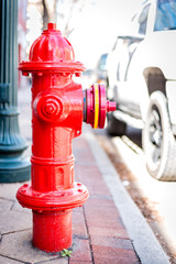 Fire hydrant on sidewalk shallow depth of field