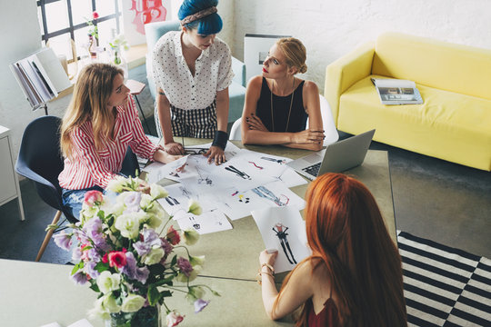 Women Fashion Designers Working