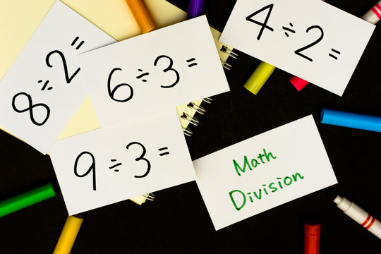 Math Division; A Sketchbook and pens on Black Background