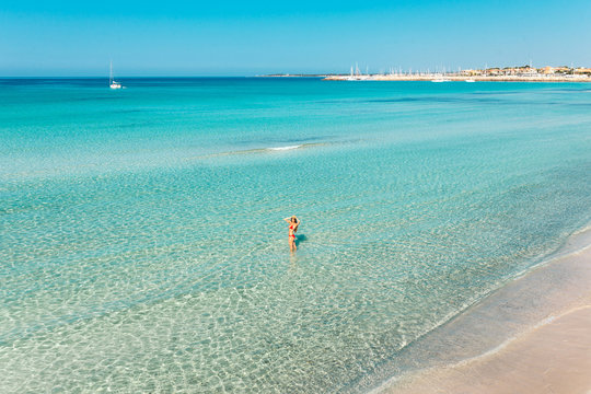 On the distance: woman on a mediterranean beach