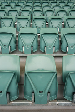 stadium seats, empty, except for that bit of gum on seat 17