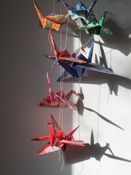 Japanese origami cranes hanging in bedroom