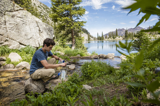 Hiker Filters Water From Stream