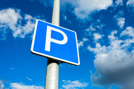 car parking sign for cars on the pillar