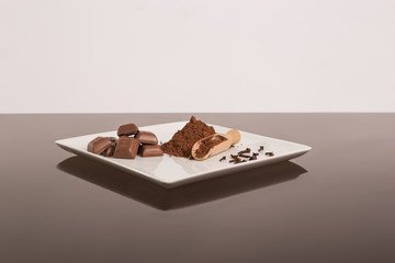 Chocolate with cinnamon and cloves on the glass table