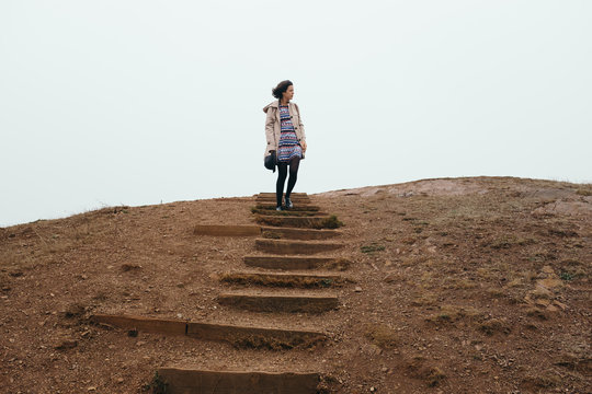 Female traveler descending steps from top of Twin Peaks lookout
