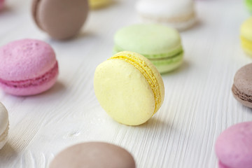 Only ispechennye macarons on a wooden table