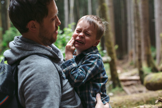 Young Caucasian Dad Spending Time With Kids Outdoors