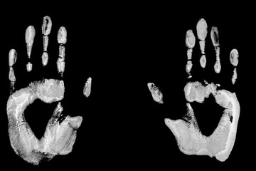 Imprint of white hand on a dark background closeup