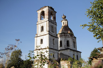 destroyed stone orthodox church and  bell tower in  north of Russia Vologda region