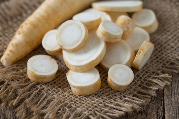 parsnip on wooden surface