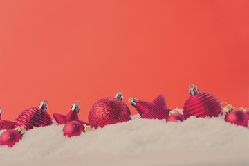 Christmas scene with snow - row of balls with red background, retro toned