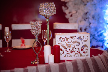 Wedding decorated table with candles and champagne in the tenderly light blue style