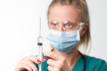 Female doctor with syringe.