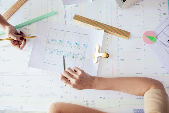 Engineers Working on Blueprint
