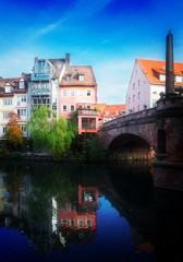 View of Karlsbrucke and Old town of Nuremberg over Pegnitz river, Germany, retro toned